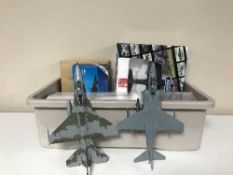 A crate of die cast boxed and unboxed aircraft