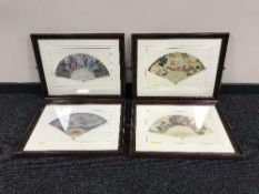A set of four framed prints depicting hand fans