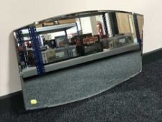 A frameless bevelled edge mirror