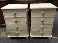 A pair of light pine four drawer chests