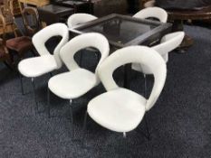 A square extending table and six vinyl upholstered chairs