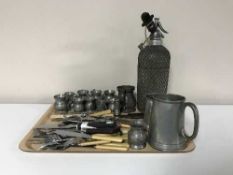 A tray of vintage soda syphon, miniature pewter tankards,