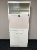 A mid 20th century kitchen cabinet