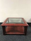 A set of three graduated leather tables and a coffee table