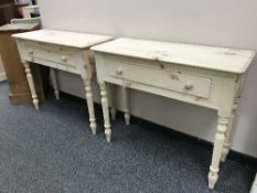 A pair of light pine single drawer side tables