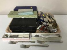 A tray of boxed and un-boxed cutlery