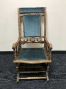 An early 20th century oak rocking chair