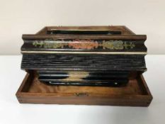 An accordion in pine box