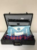 A leather briefcase containing Masonic regalia