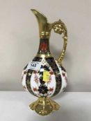 A Royal Crown Derby gilded ewer,
