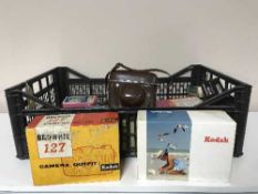 A box containing a quantity of cameras together with a boxed metal detector