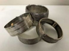 Four antique silver bangles