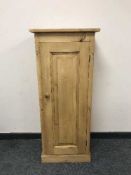 A reclaimed pine single door cupboard