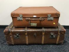 A vintage canvas bound luggage case and a leather suitcase