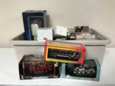 A collection of die cast vehicles - buses, trams,