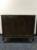 An oak linen chest and oak smoker's stand