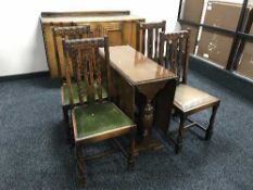 An early 20th century oak drop leaf table,