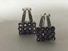 A pair of 18ct white gold tanzanite and diamond set earrings