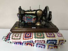 A Jones sewing machine together with a quantity of woollen blankets