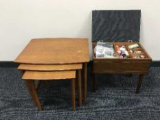 A teak nest of three tables and a work box
