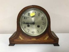 An Edwardian inlaid mahogany mantel clock with silvered dial