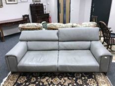 A contemporary Italian grey leather settee with adjustable head rests