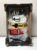 A box of five large scale Burago die cast vehicles