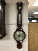 A nineteenth century mahogany barometer with silvered dial