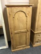 A reclaimed pine single door cupboard