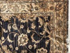 A fringed Ziegler carpet 230 cm x 160 cm on blue ground