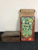 A bagatelle game in box and a vintage leather suitcase