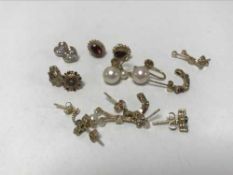 Eight pairs of gold earrings,
