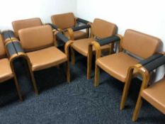 A set of eight stained beech and leather boardroom chairs