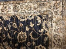 A fringed Ziegler carpet 230 cm x 160 cm on blue ground