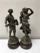 A pair of spelter figures on wooden bases bearing plaques Semeur Per H Moreau and Morissonneuse Par