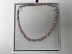 Strap of fine pearls on an 18ct clasp