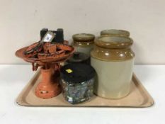 A tray of container of glass marbles, vintage scales with weights,
