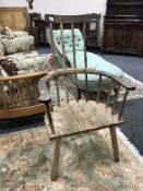 An antique rustic pine armchair