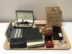 A tray of simulated pearls, pen knives, cuff links, prayer books,