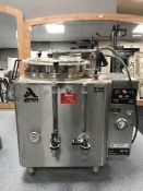 A stainless steel American metal water boiler