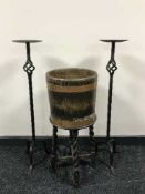 An oak copper bound planter on barleytwist stand together with two metal candle holders