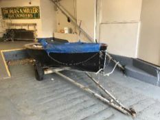 A 14' wooden sailing boat with mast and sail on double axel aluminium trailer