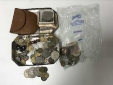 A Coronation tin containing coins including silver threepence pieces, Crowns, French coins,