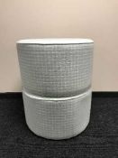 A pair of contemporary circular footstools