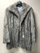 A grey fur lady's jacket.