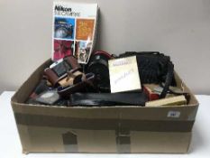 A box of cameras, various camera equipment,