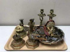 A tray of metal ware, ornate brass candlesticks, plated items, dishes,