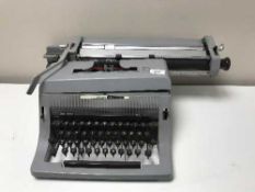 An Olivetti 88 typewriter together with a Sharp Sg-320 estereo music centre