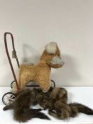 A vintage case containing a dress, fur stole,