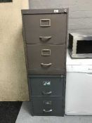 Two four drawer metal filing cabinets